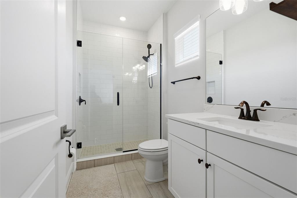 16131 Volterra Point Bella Collina, FL 34756 - Photo 43 of 52 a bathroom with a sink a toilet and shower