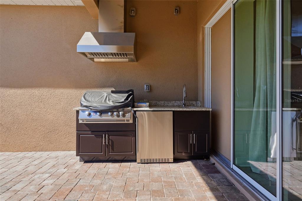 16131 Volterra Point Bella Collina, FL 34756 - Photo 45 of 52 a kitchen with granite countertop a stove and a sink
