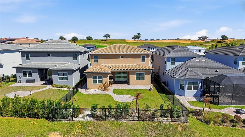 16131 Volterra Point Bella Collina, FL 34756 - Photo 47 of 52 an aerial view of a house with swimming pool and big yard