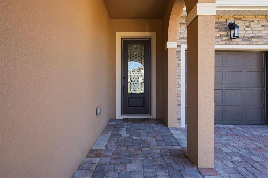 16131 Volterra Point Bella Collina, FL 34756 - Photo 6 of 52 a view of a hallway with wooden floor and a bathroom