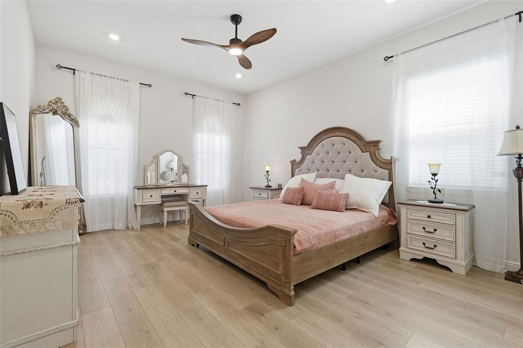16131 Volterra Point Bella Collina, FL 34756 - Photo 7 of 52 a bedroom with a bed and a dresser