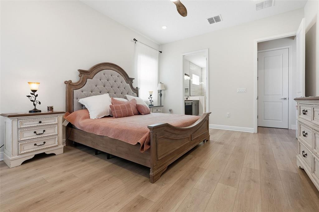 16131 Volterra Point Bella Collina, FL 34756 - Photo 8 of 52 a bedroom with a bed and a dresser