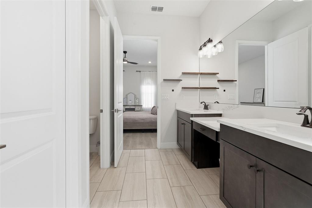16131 Volterra Point Bella Collina, FL 34756 - Photo 10 of 52 a kitchen with a sink cabinets and appliances