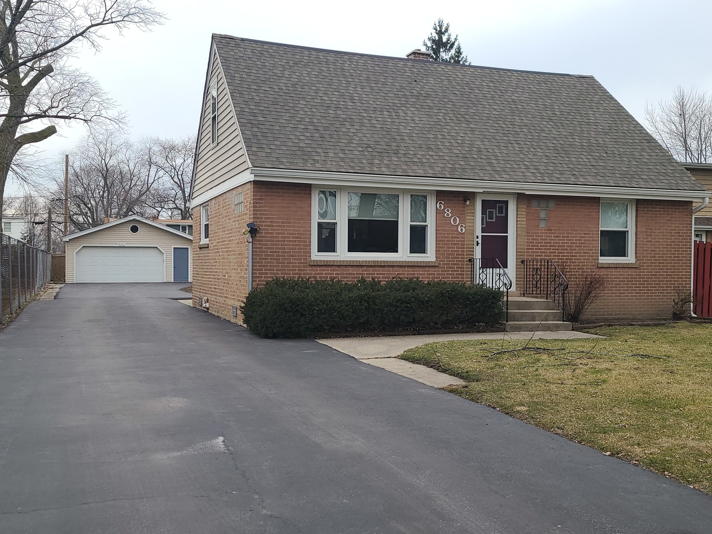a house that has a tree in front of it