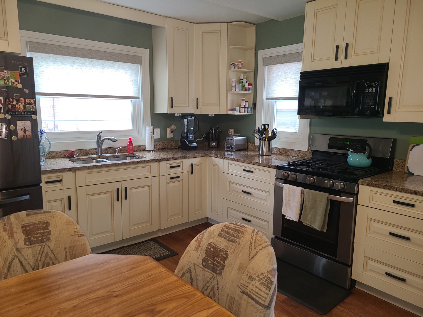 6806 Maple Court Bridgeview, IL 60455 - Photo 12 of 26 a kitchen with stainless steel appliances white cabinets and a sink