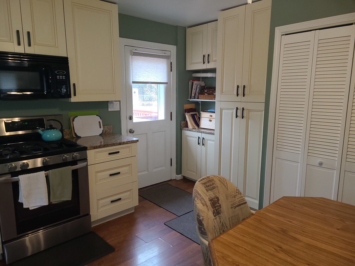 6806 Maple Court Bridgeview, IL 60455 - Photo 14 of 26 a bedroom with a bed and a cabinets