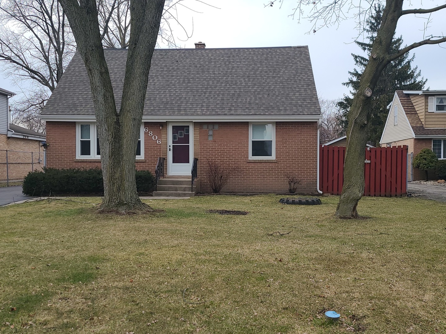 6806 Maple Court Bridgeview, IL 60455 - Photo 2 of 26 a house that has a tree in front of it