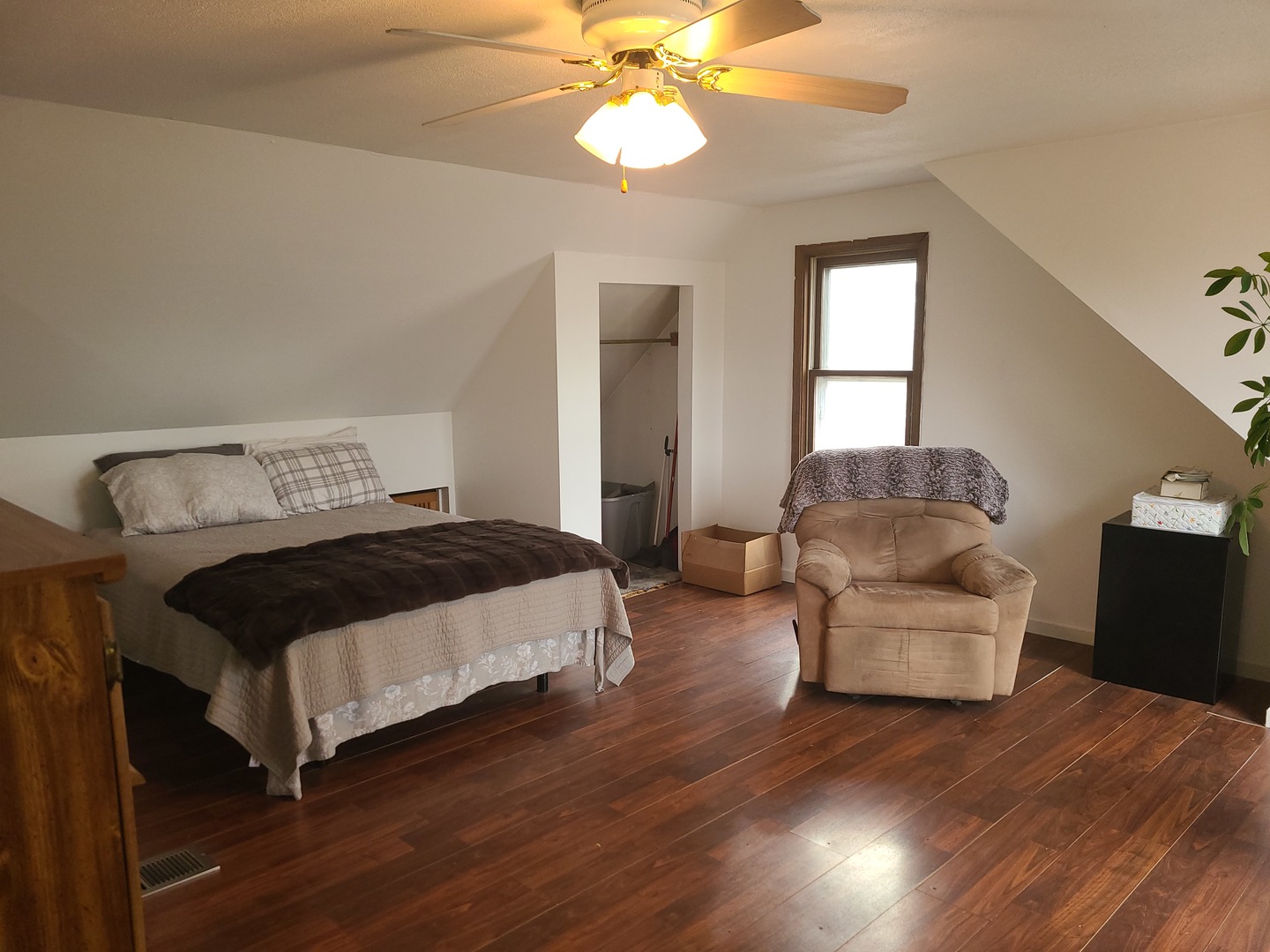 6806 Maple Court Bridgeview, IL 60455 - Photo 25 of 26 a bedroom with a bed and a couch