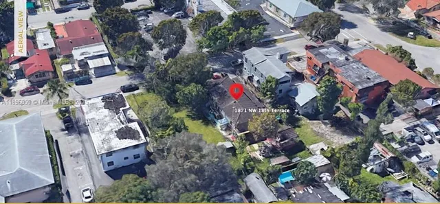 an aerial view of residential house with outdoor space