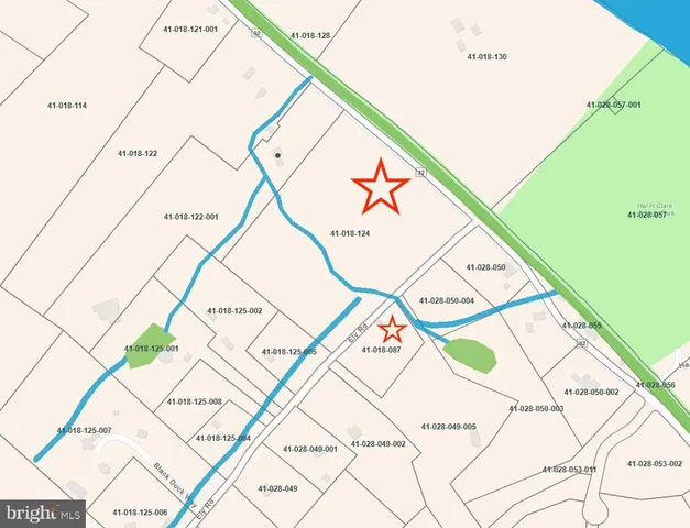 a picture of white floor with a table and a potted plant