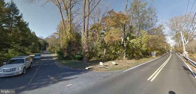 a view of a city street with a building