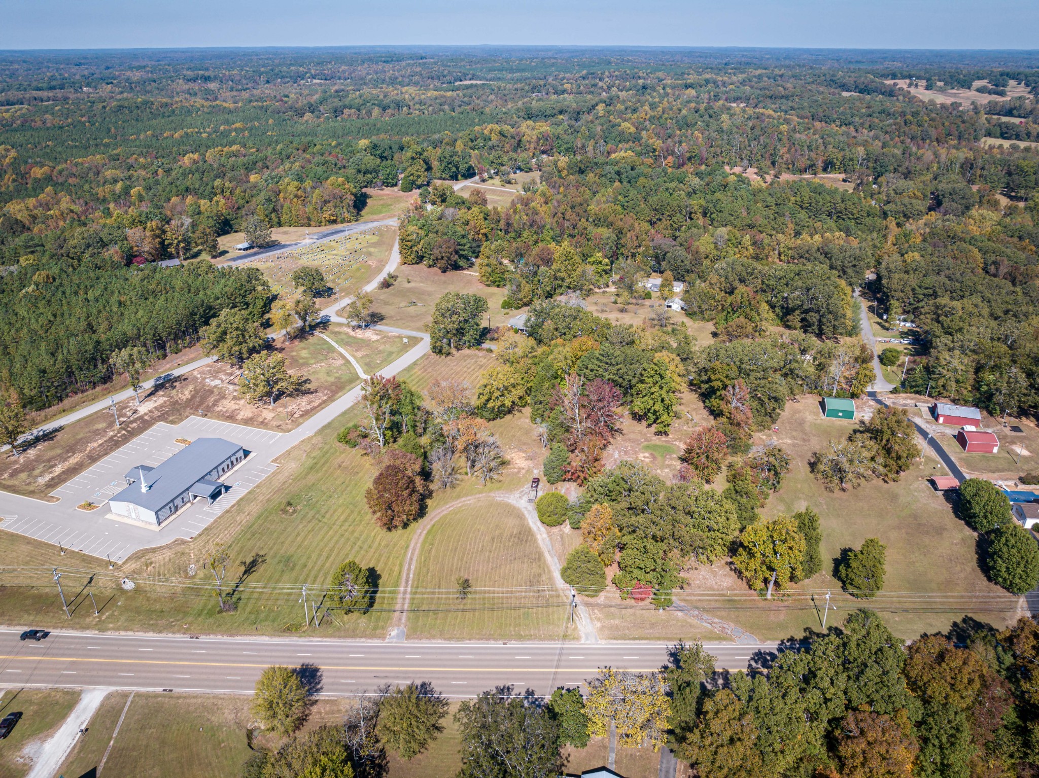 0 Main Street West Parsons, TN 38363 - Photo 1 of 16 an aerial view of residential houses with outdoor space