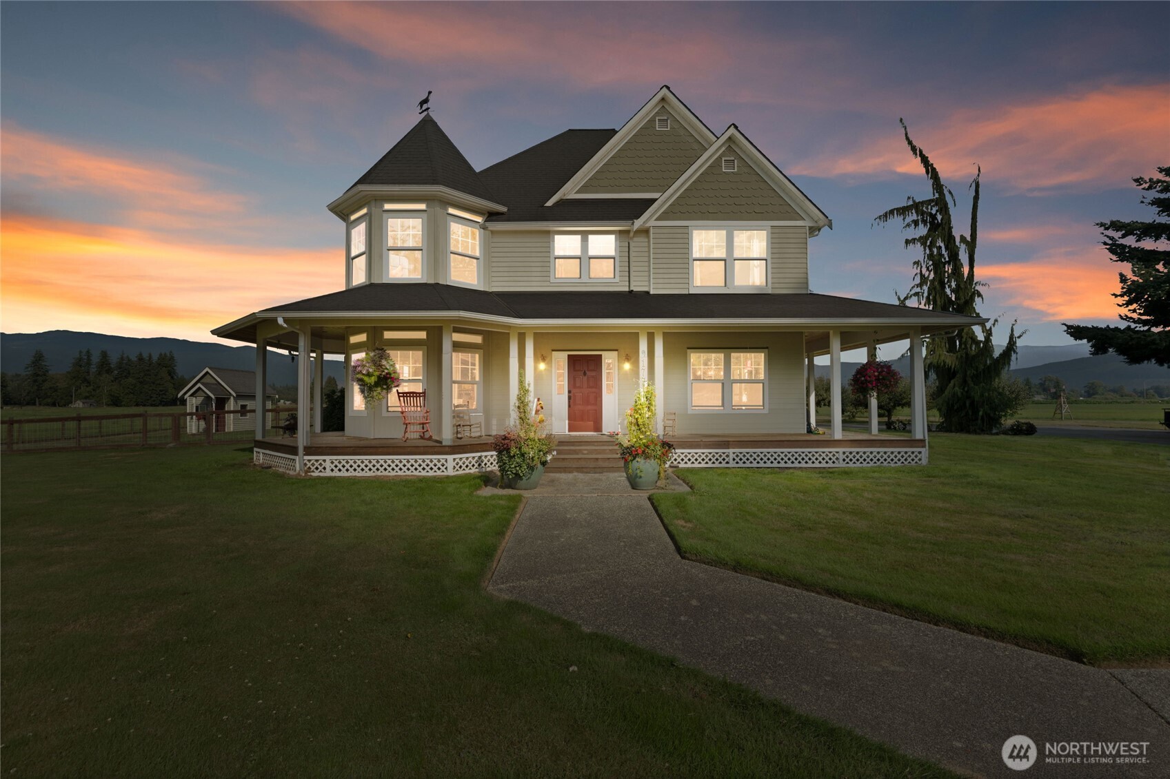 a front view of a house with a garden