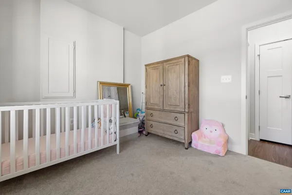 a bedroom with a baby bed