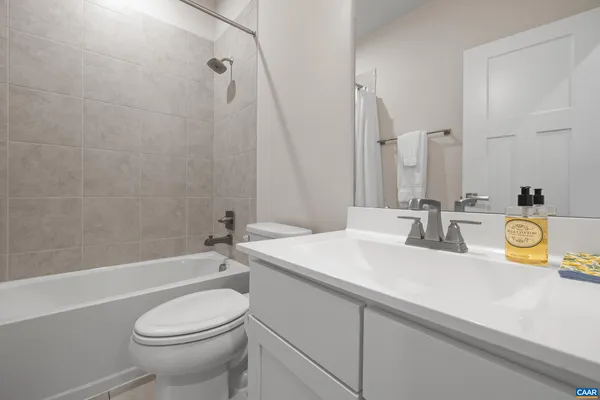 a bathroom with a sink a toilet and a bathtub