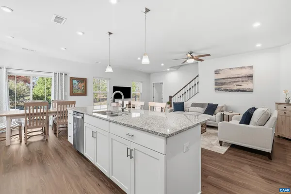 a kitchen with counter space cabinets and wooden floor