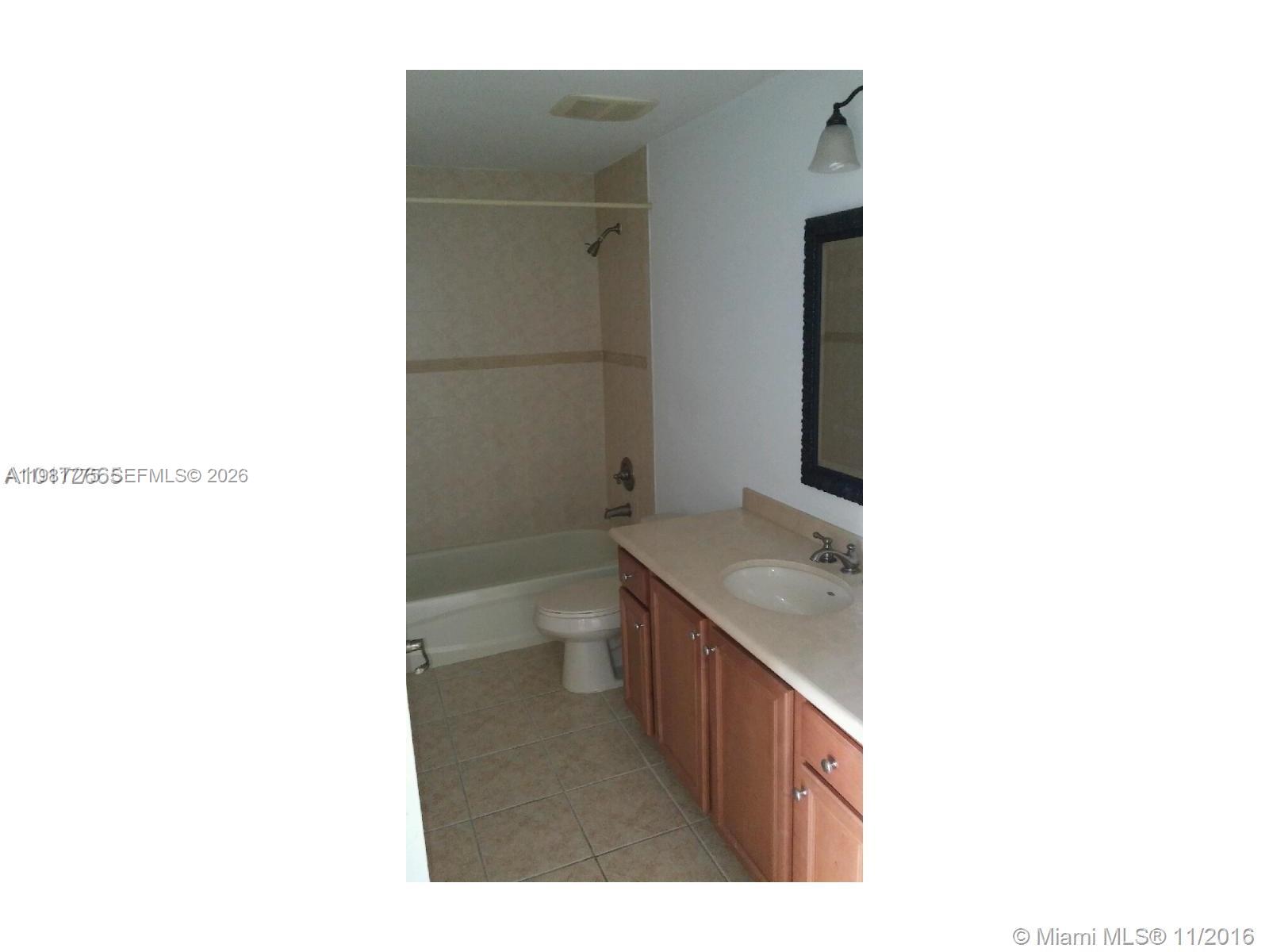 5271 Southwest 8th Street, Unit 314 Miami, FL 33134 - Photo 3 of 4 a bathroom with a sink and a toilet