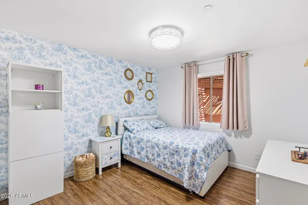 a view of a swimming pool with a lawn chairs and a fire pit