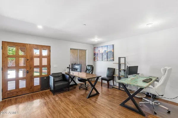 a view of a chairs and table in backyard of the house