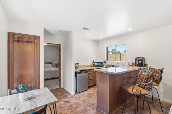 an aerial view of a house with garden space and street view