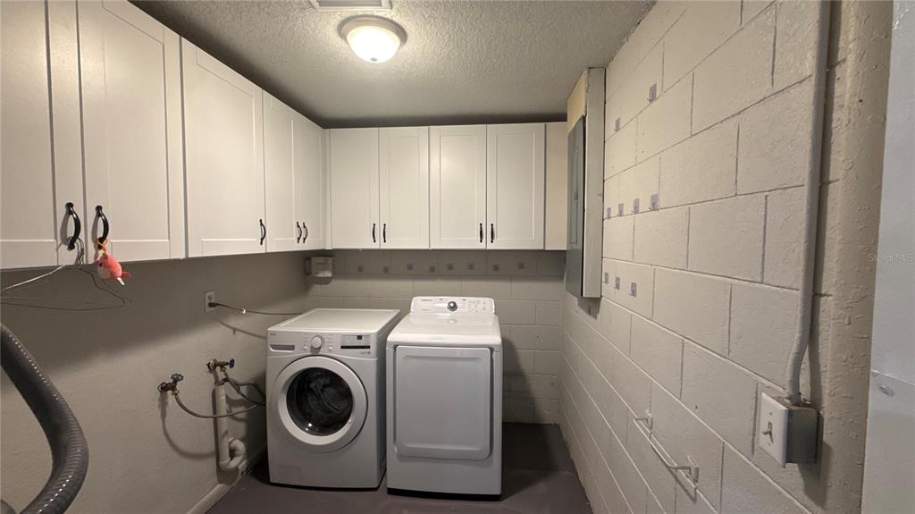 8106 Wichita Way Tampa, FL 33619 - Photo 8 of 21 a utility room with dryer and washer
