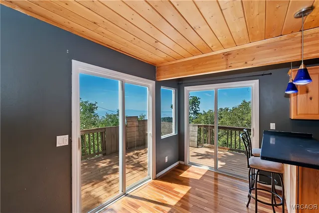 a kitchen with granite countertop a sink a counter top space and cabinets