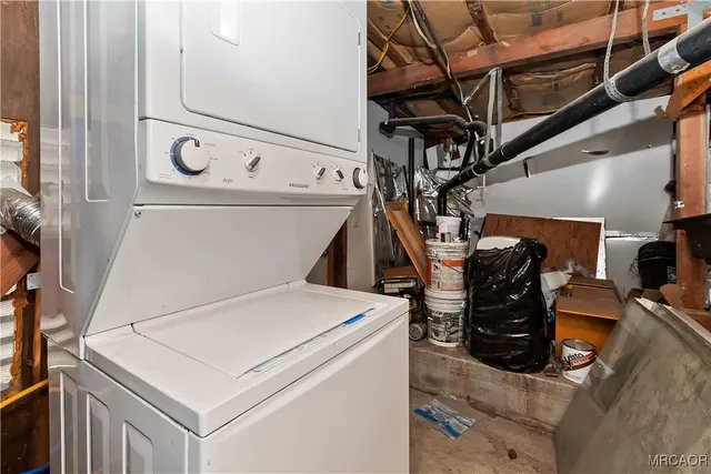 a view of a yard with wooden fence