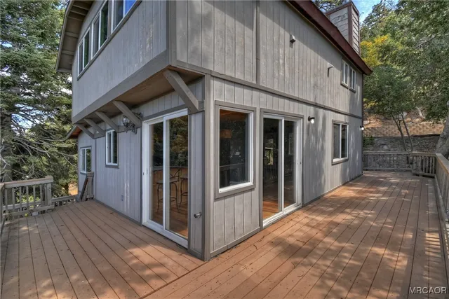 a view of a house with wooden floor and fence