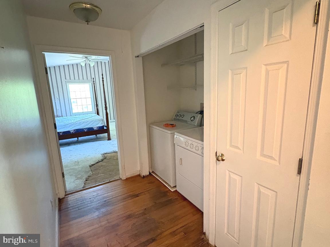 4215 Buffalo Road Mount Airy, MD 21771 - Photo 13 of 44 a view of a hallway with wooden floor and closet