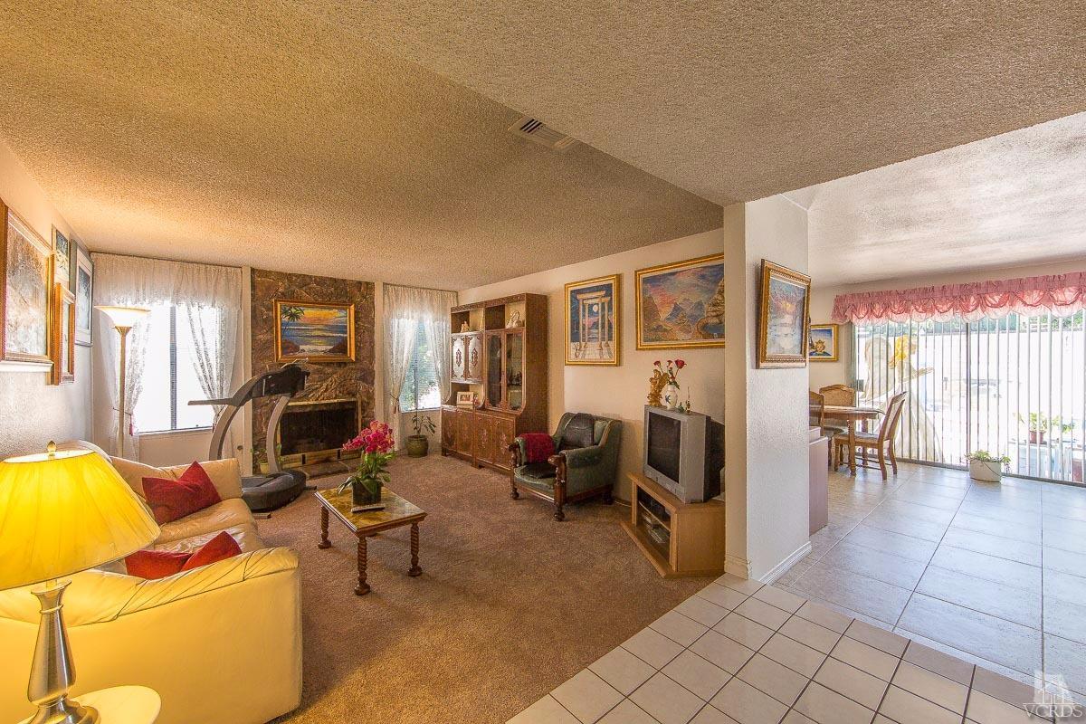 6128 Al Way Simi Valley, CA 93063 - Photo 2 of 27 a living room with furniture and a flat screen tv