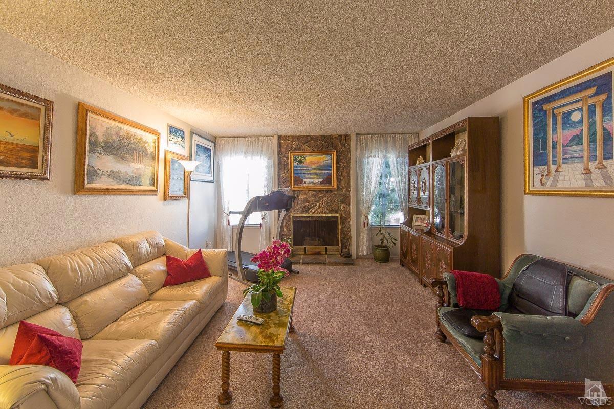 6128 Al Way Simi Valley, CA 93063 - Photo 3 of 27 a living room with furniture flowerpot and a window