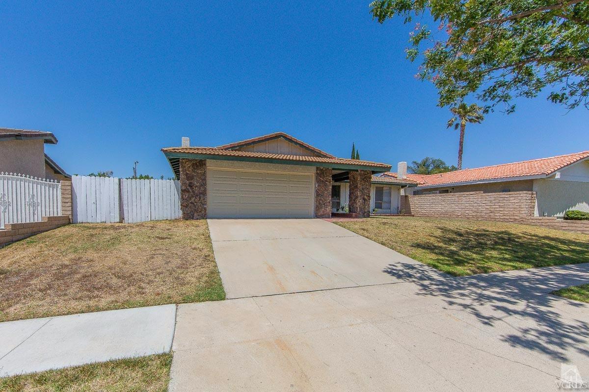 6128 Al Way Simi Valley, CA 93063 - Photo 26 of 27 a front view of a house with a yard and garage