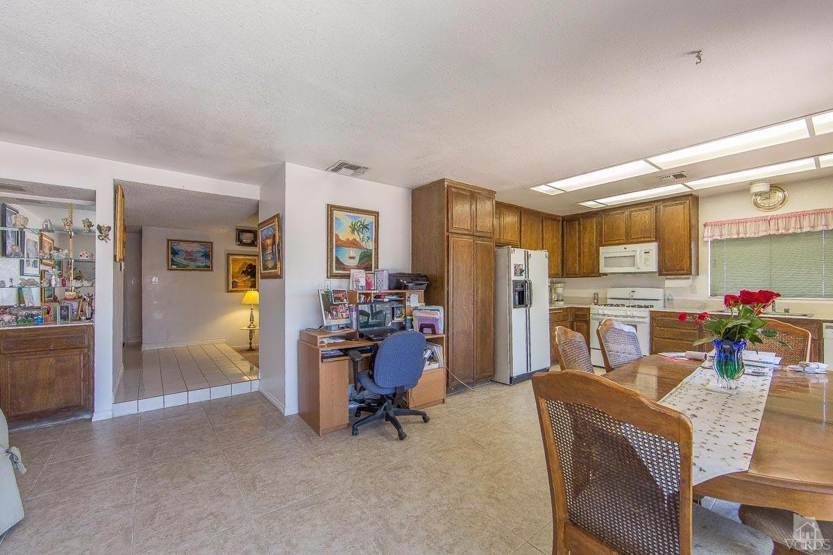 6128 Al Way Simi Valley, CA 93063 - Photo 6 of 27 a view of a livingroom with dining room and furniture