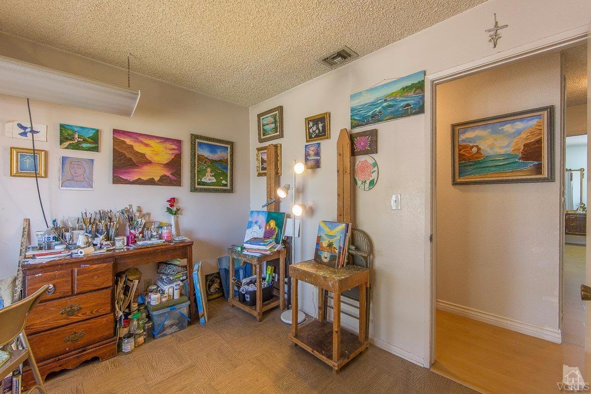 6128 Al Way Simi Valley, CA 93063 - Photo 10 of 27 a room with furniture a couch and a painting on the wall