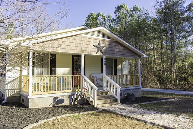 860 Reuben Allen Road Roxboro, NC 27574 - Photo 1 of 17 a front view of a house with a porch