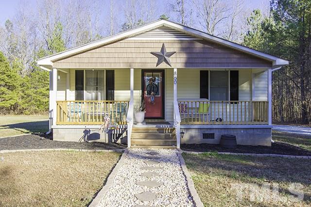 860 Reuben Allen Road Roxboro, NC 27574 - Photo 2 of 17 a front view of a house with a porch