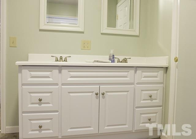 860 Reuben Allen Road Roxboro, NC 27574 - Photo 14 of 17 a bathroom with a sink and a mirror