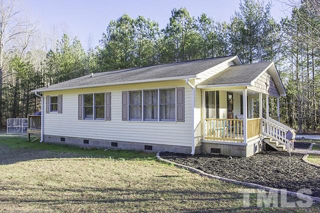 860 Reuben Allen Road Roxboro, NC 27574 - Photo 16 of 17 a front view of a house with a yard