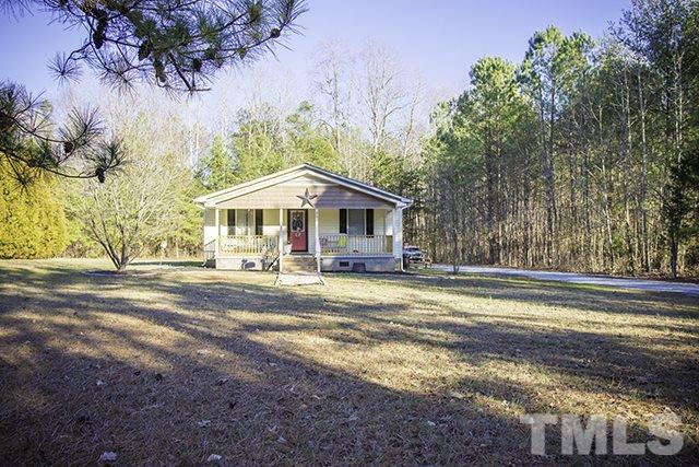 860 Reuben Allen Road Roxboro, NC 27574 - Photo 17 of 17 a view of a house with a yard and sitting area