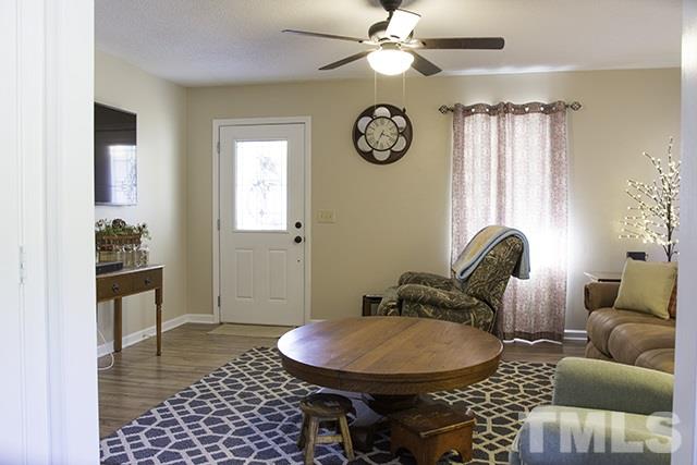 860 Reuben Allen Road Roxboro, NC 27574 - Photo 7 of 17 a living room with furniture and a window