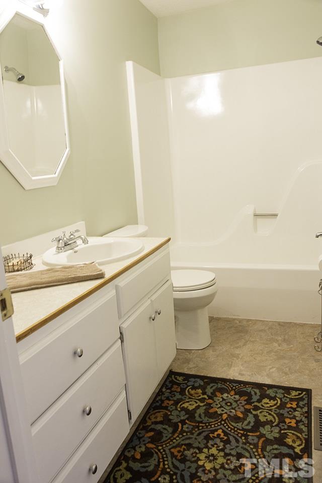 860 Reuben Allen Road Roxboro, NC 27574 - Photo 10 of 17 a bathroom with a sink and a mirror