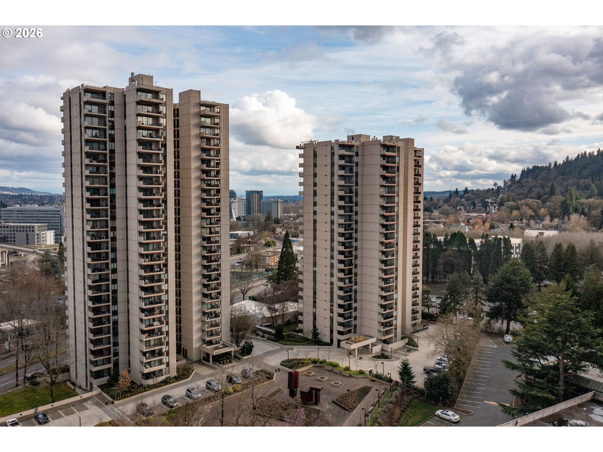 a view of a city with tall buildings