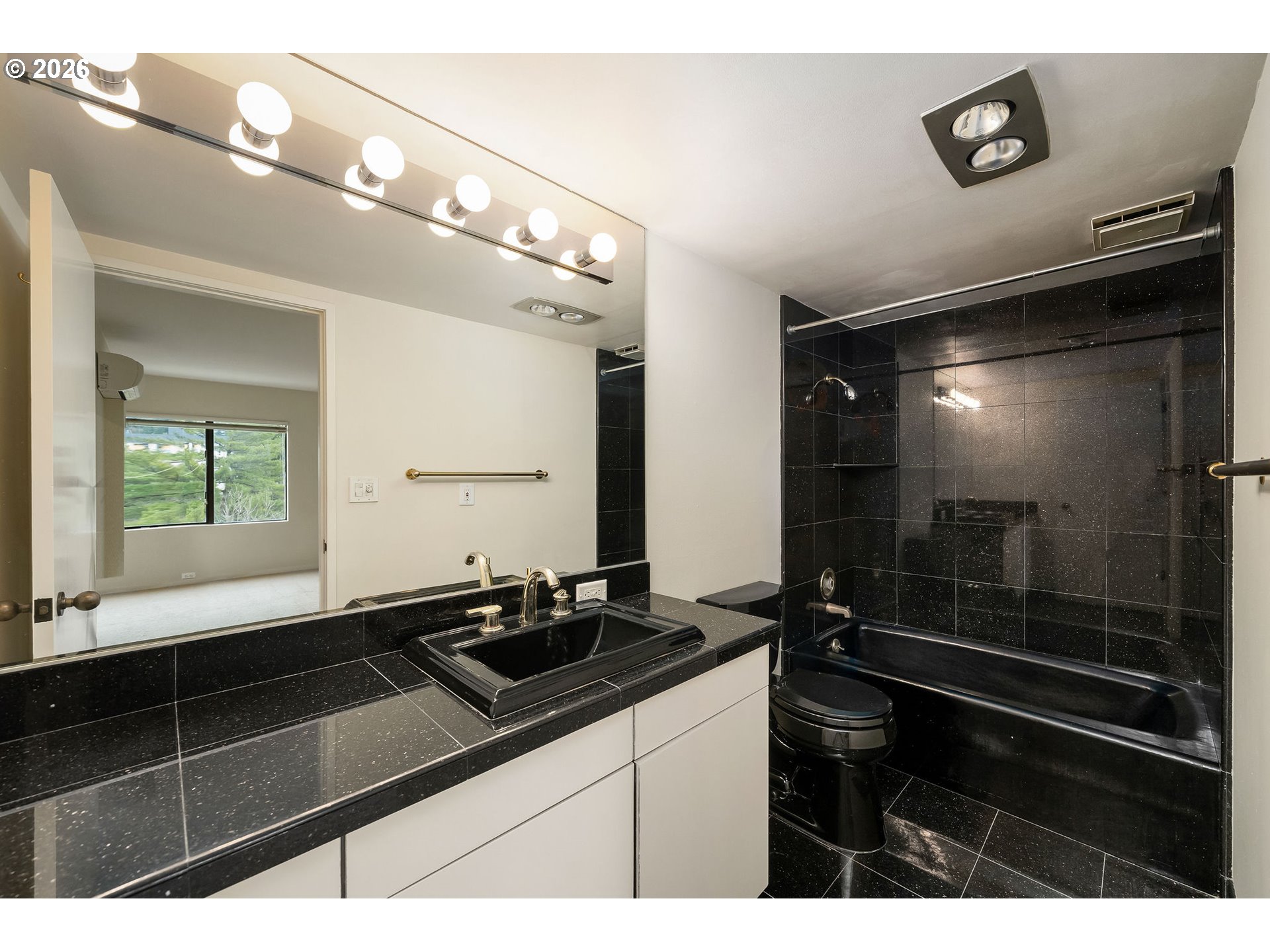 2309 Southwest 1st Avenue, Unit 741 Portland, OR 97201 - Photo 29 of 36 a bathroom with a sink and a mirror