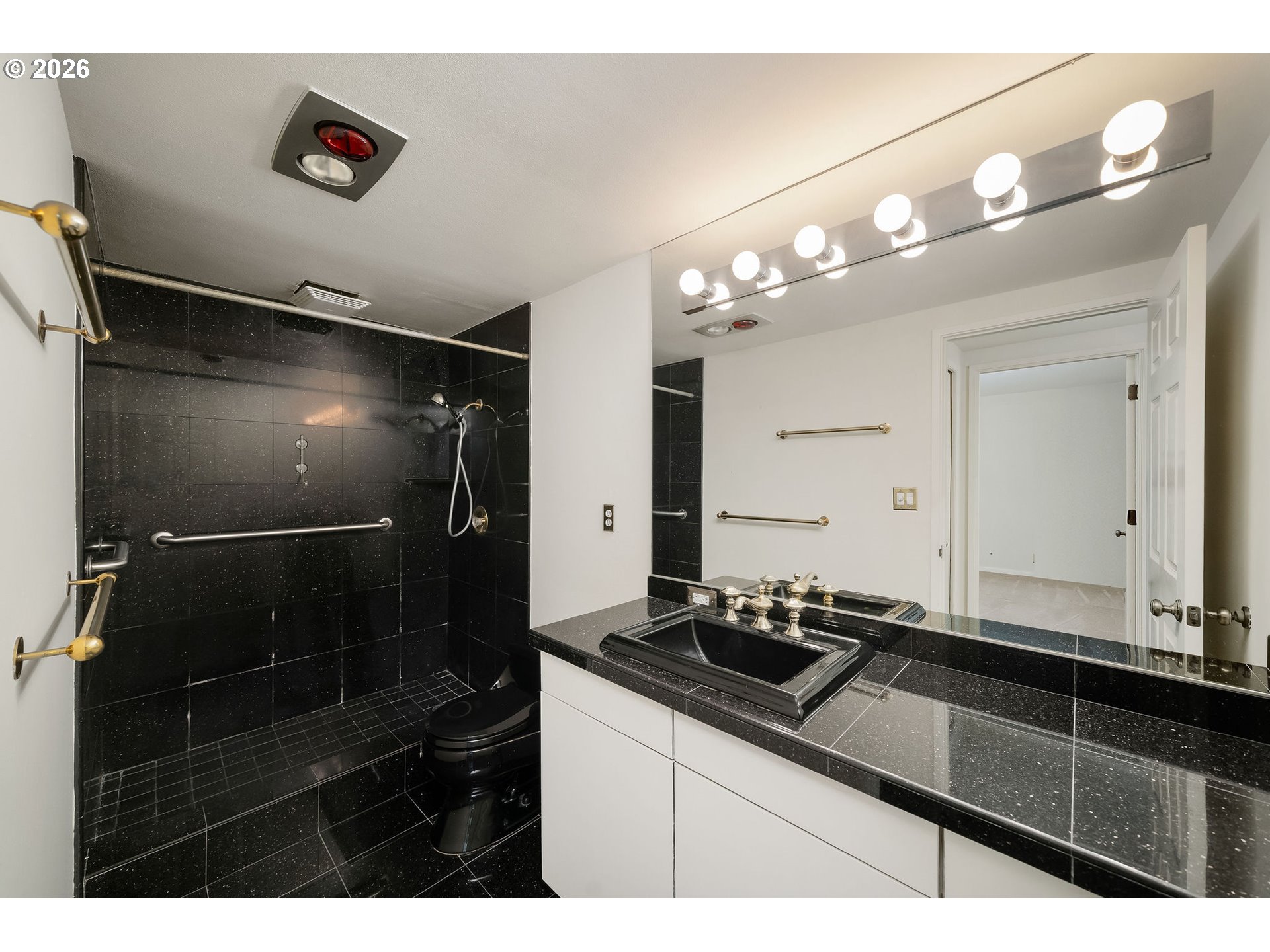 2309 Southwest 1st Avenue, Unit 741 Portland, OR 97201 - Photo 31 of 36 a bathroom with a sink and a mirror