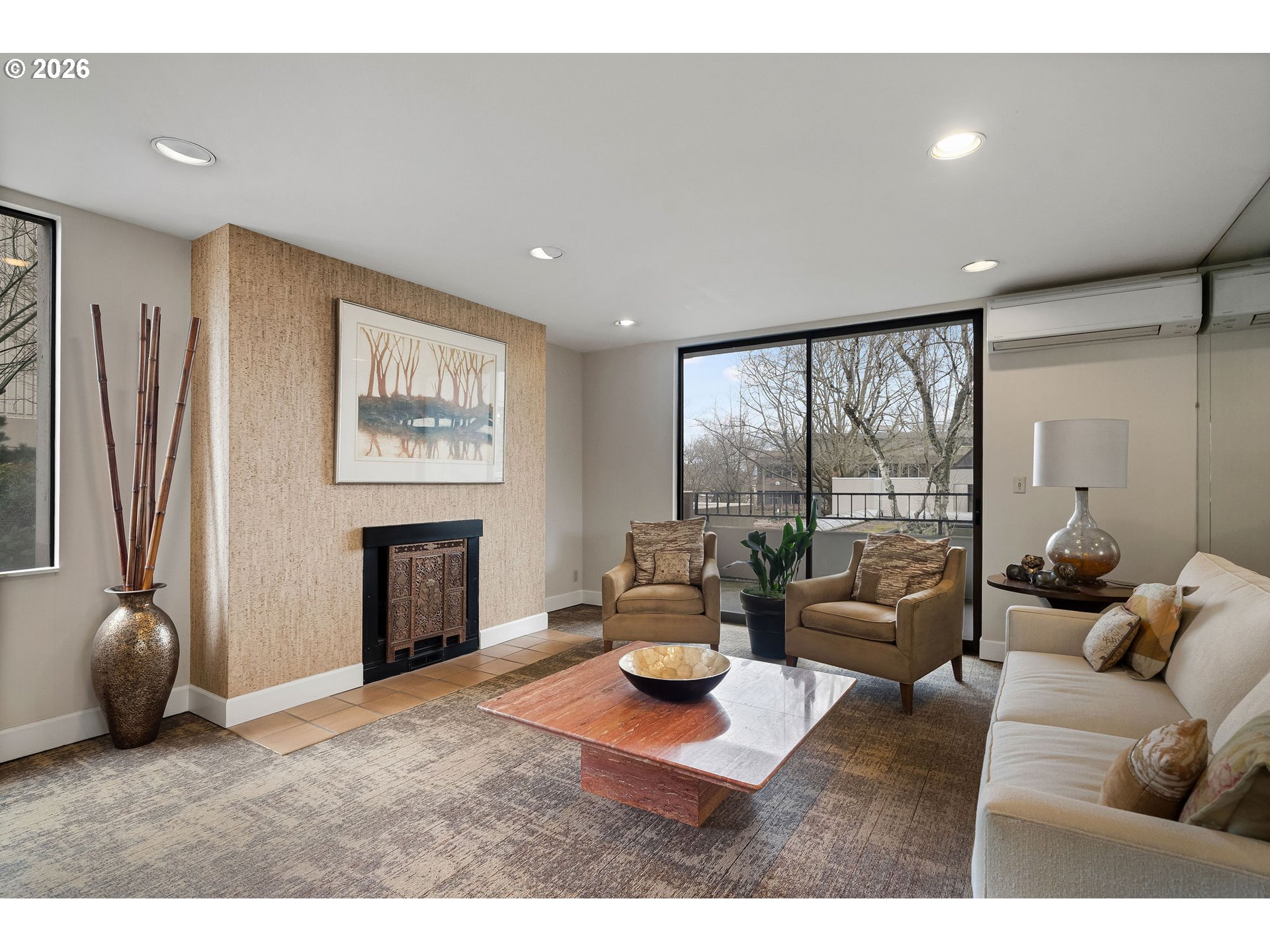 2309 Southwest 1st Avenue, Unit 741 Portland, OR 97201 - Photo 8 of 36 a living room with furniture a large window and a flat screen tv