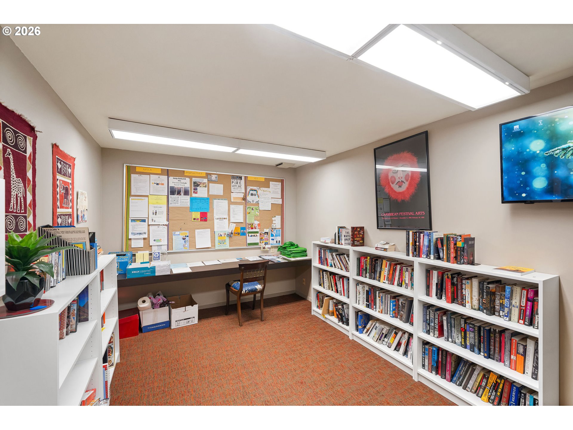 2309 Southwest 1st Avenue, Unit 741 Portland, OR 97201 - Photo 9 of 36 a room with furniture a bookshelf and a window