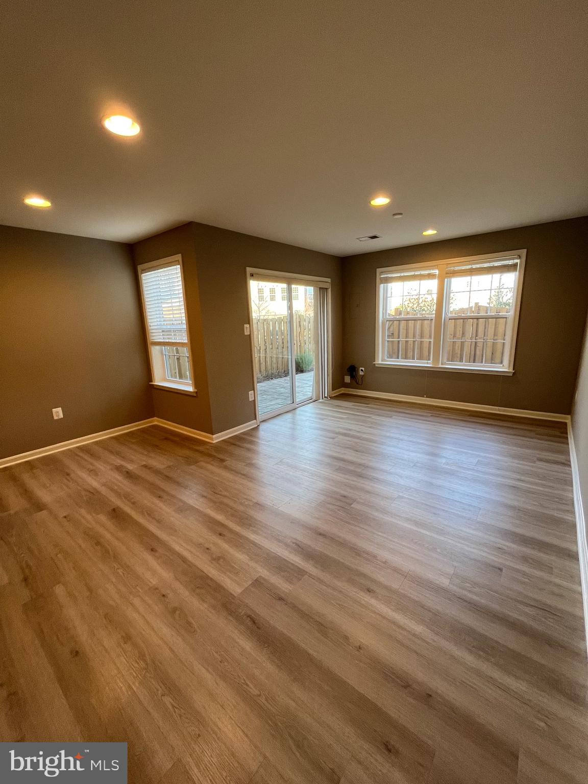 42253 Dean Chapel Square Chantilly, VA 20152 - Photo 16 of 24 an empty room with wooden floor and windows
