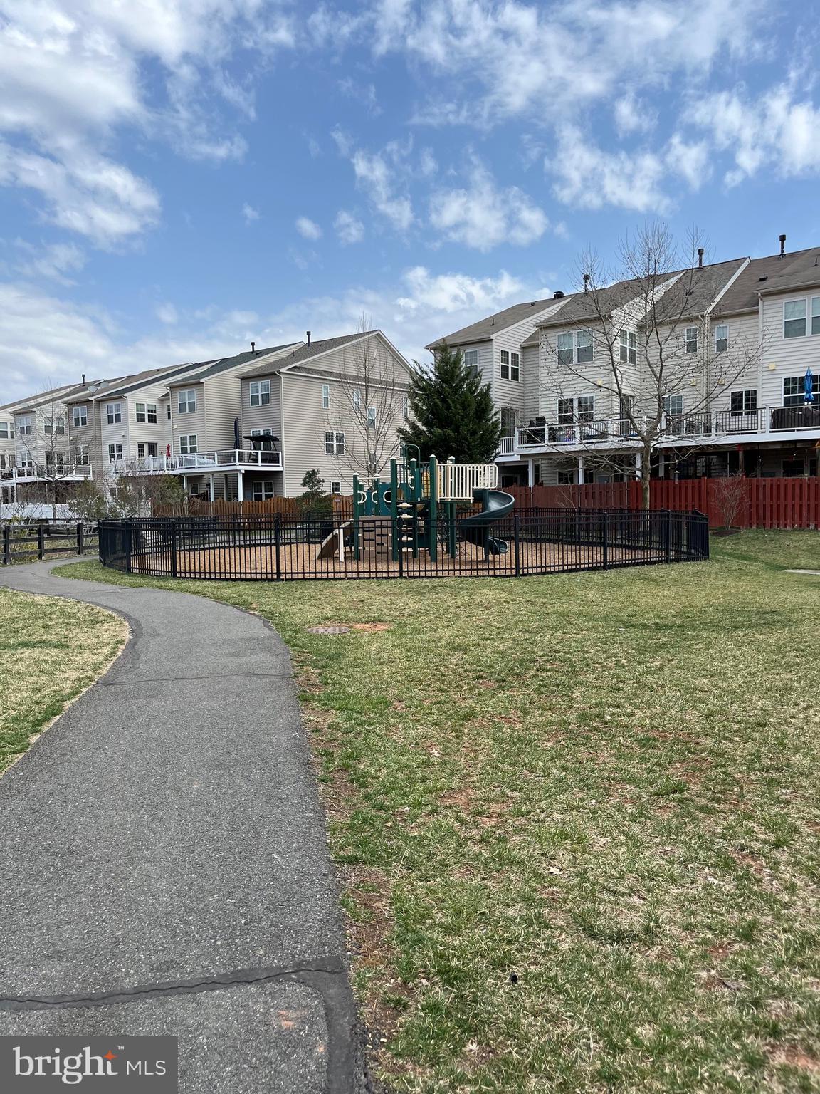 42253 Dean Chapel Square Chantilly, VA 20152 - Photo 24 of 24 a view of a big yard next to a building