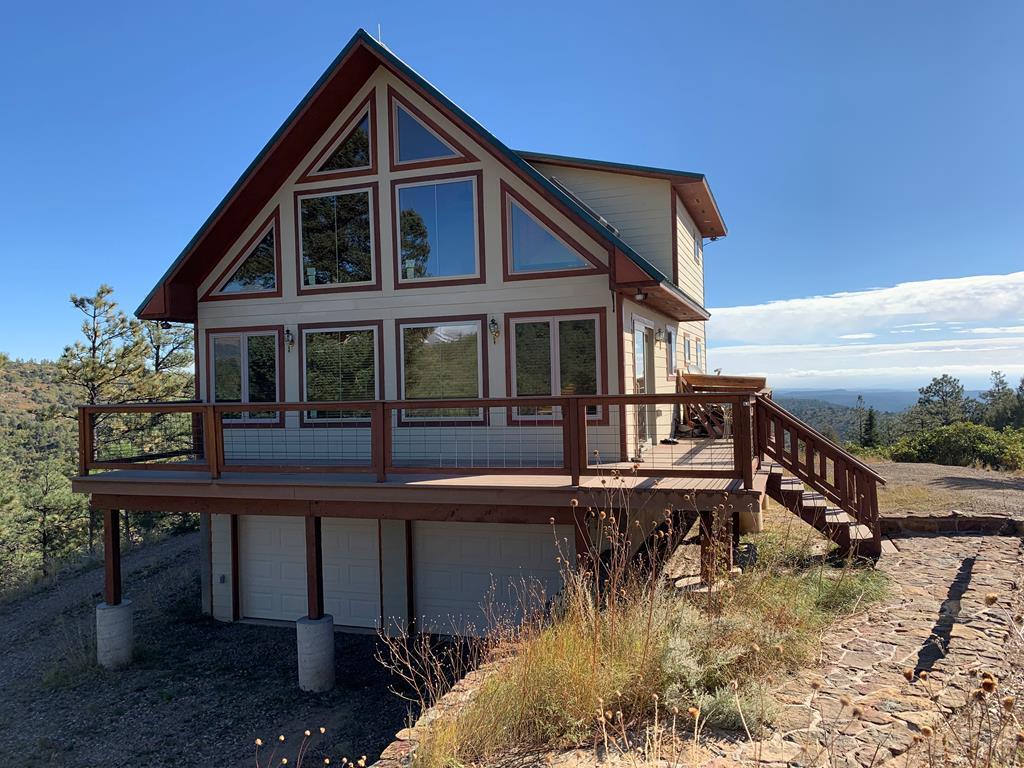 13220 Stonewall Parallel Road, Unit LOT 30 Weston, CO 81091 - Photo 1 of 1 a view of a house with pool and sitting area
