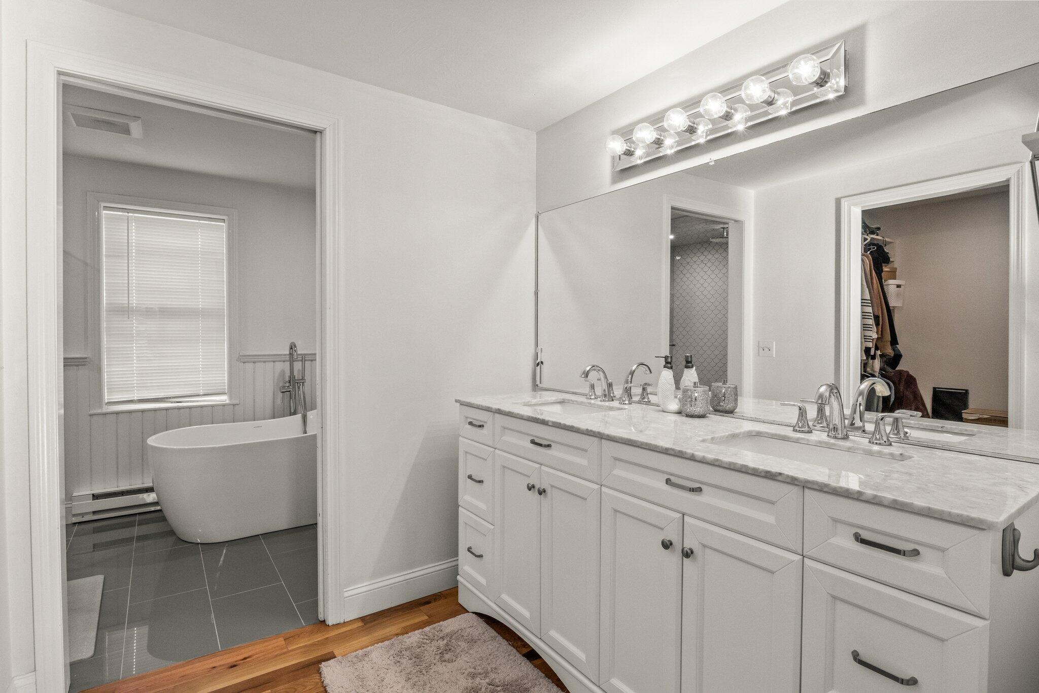 9 Deacons Path Sandwich, MA 02563 - Photo 14 of 41 a bathroom with a double vanity sink mirror and bathtub